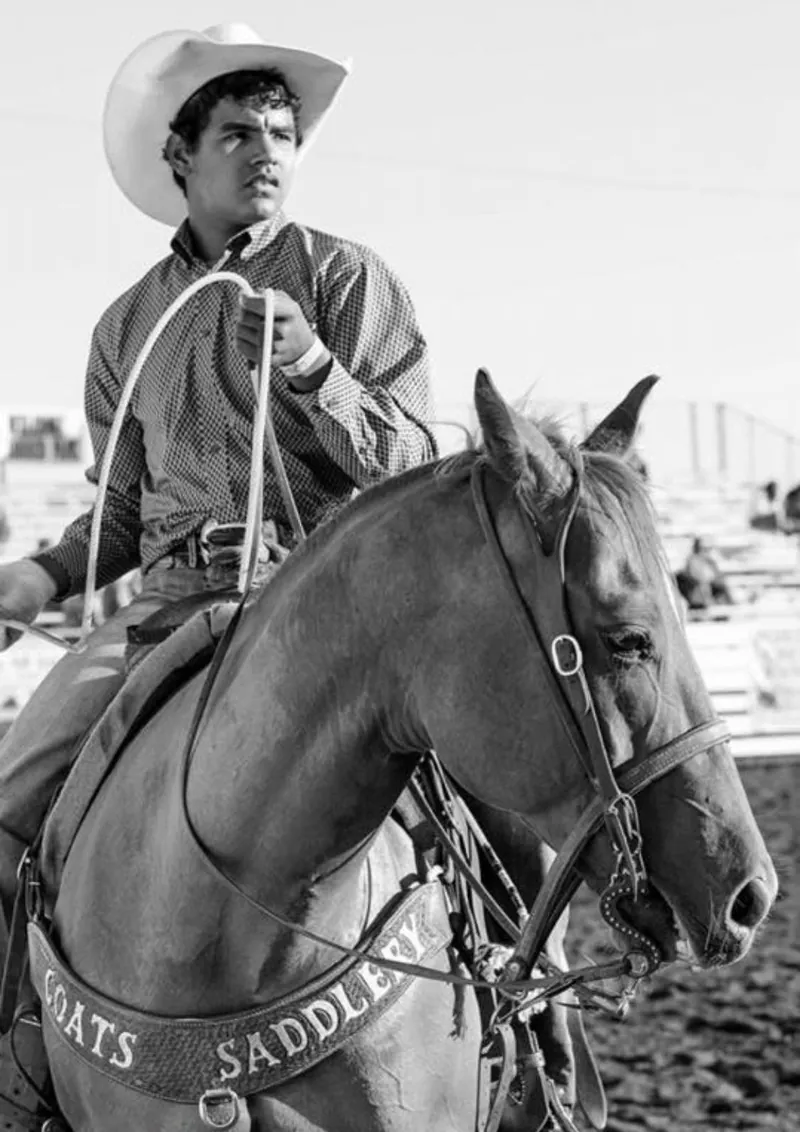 Young Phoenix on horseback in a black-and-white portrait